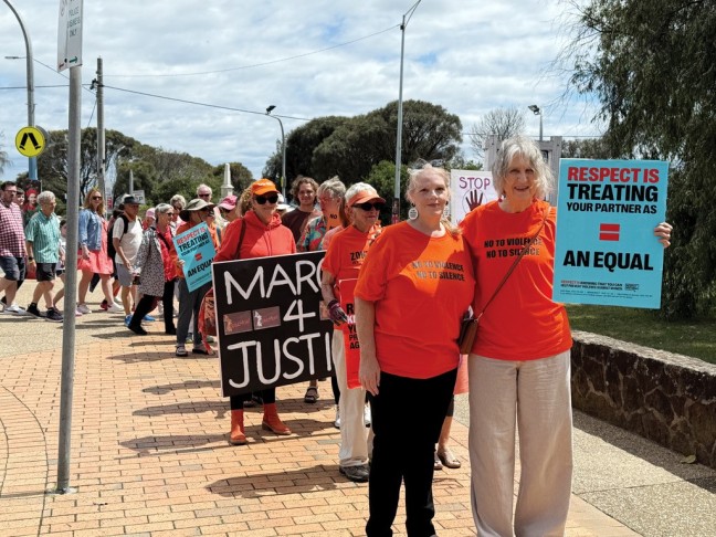 Image of people standing together marching peacefully for respect